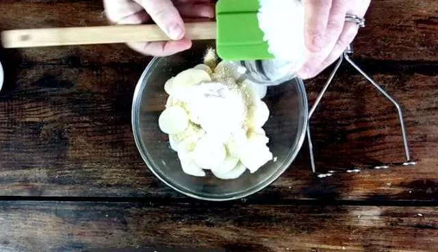 Adding the sour cream and parmesan cheese to the potatoes in the bowl