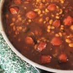 Pan of beanie weenies with green napkin