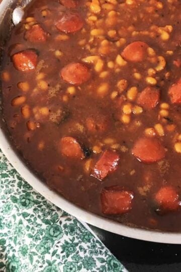 Pan of beanie weenies with green napkin