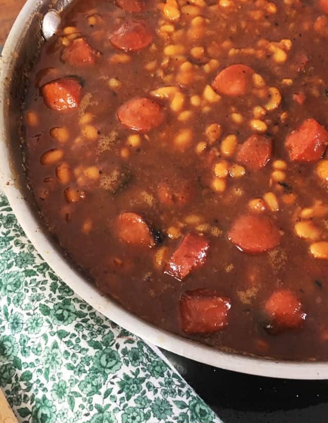 Pan of beanie weenies with green napkin