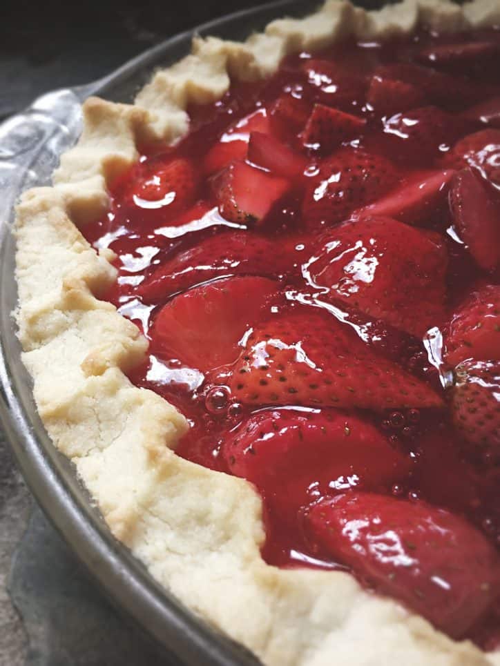picture of the edge of a strawberry pie with jello and crust