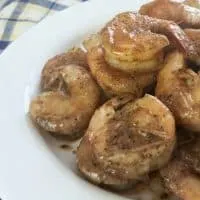 Close up of white plate of bright red shrimp