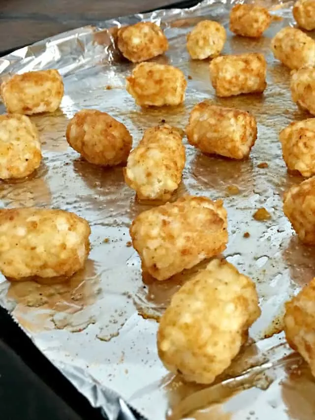 Pan lined with aluminum foil and tater tots spaced out as far as possible