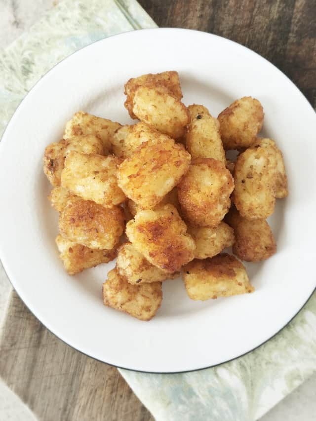 Overhead view of a plate of tater tots