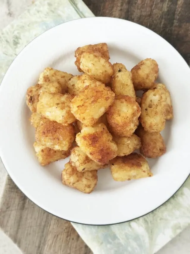 Overhead view of a plate of tater tots