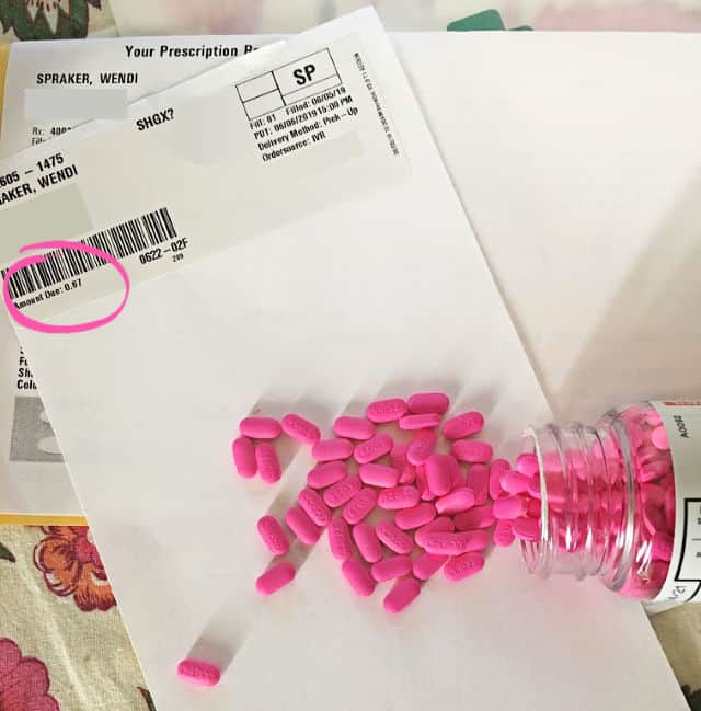 Pink pills spilled across the receipt showing 0.67 bill