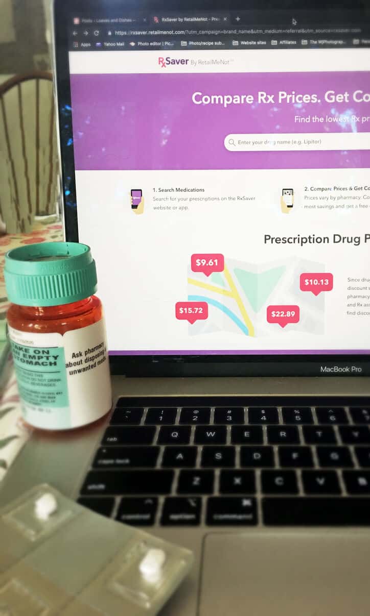lap top with prescription bottle showing rxsaver on screen