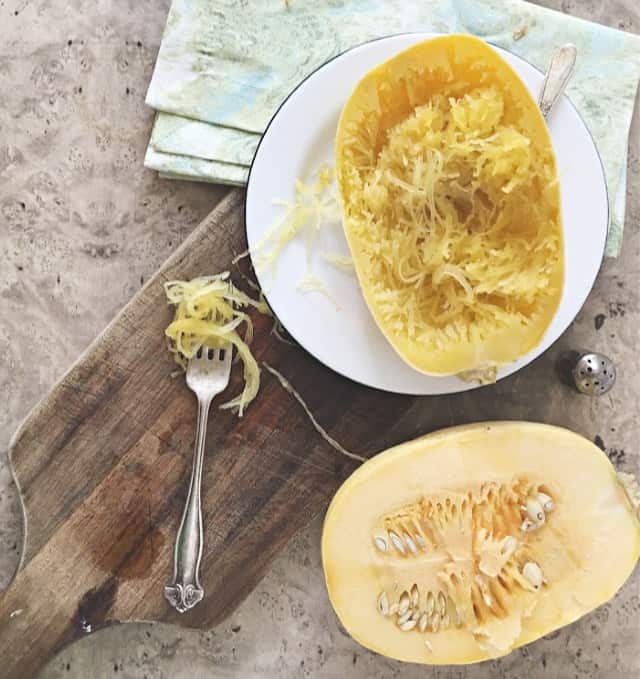 fork and squash on cutting board with green napkin