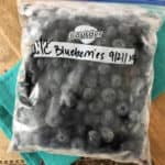 labeled quart size freezer bag of frozen blueberries