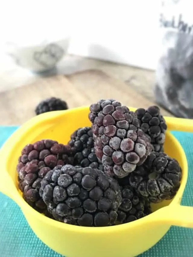 measuring up with frozen blackberries in it