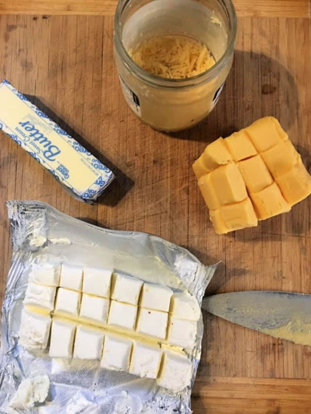 ingredients for cheese sauce on cutting board