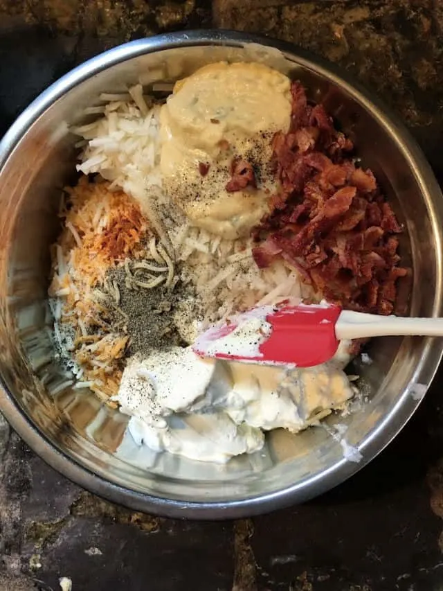 bowl of the ingredients for hashbrown casserole