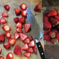 cutting board with knife and strawberries