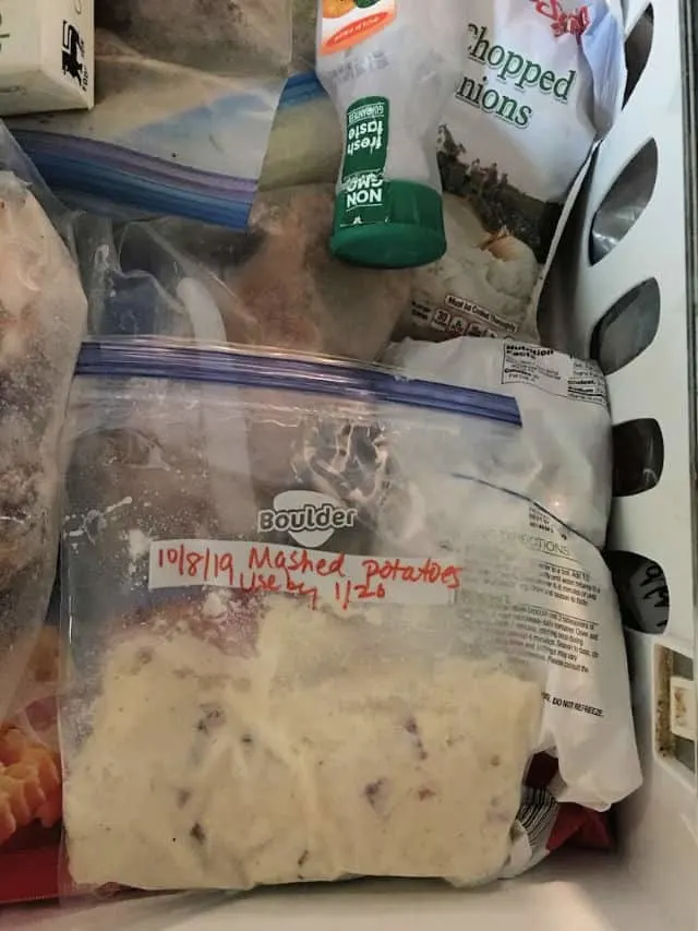 mashed potatoes in labeled bag in freezer