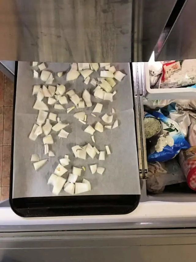 baking sheet of onions in freezer