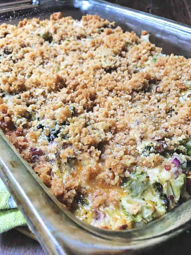 the crumbly crust of broccoli casserole in a glass baking dish