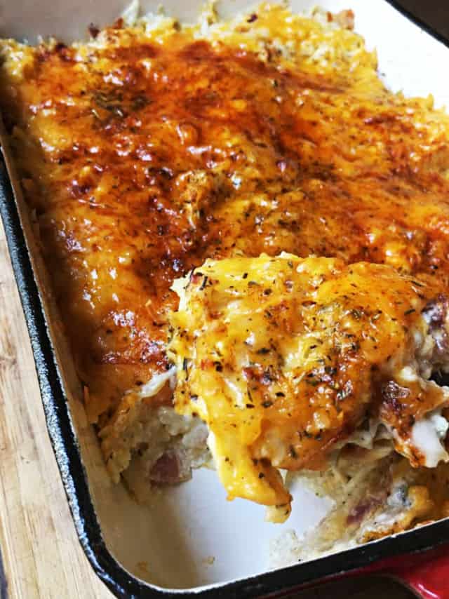 the corner of the casserole scooped out with herbs