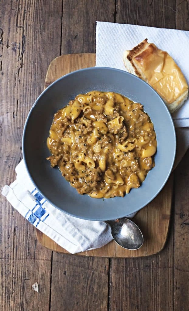 bowl of hamburger helper with white towel.