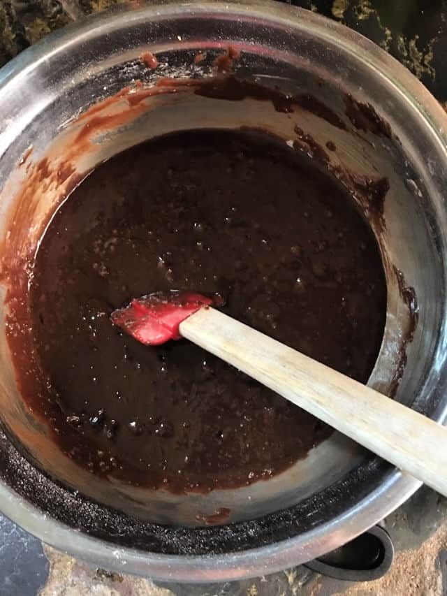 brownie batter all mixed up in bowl with spatula.