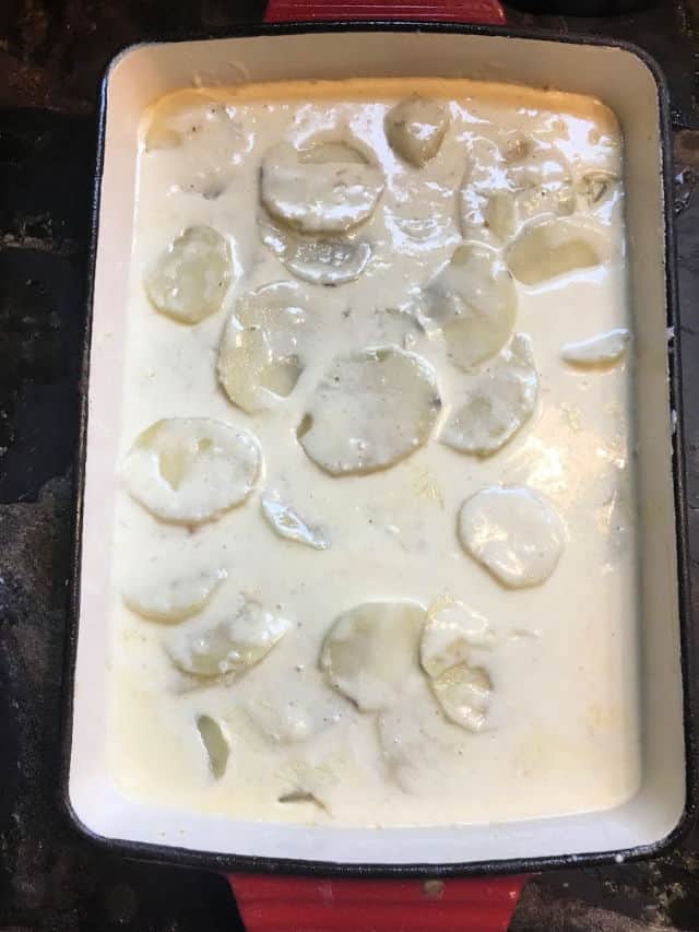 pan of creamy scalloped potatoes before being baked