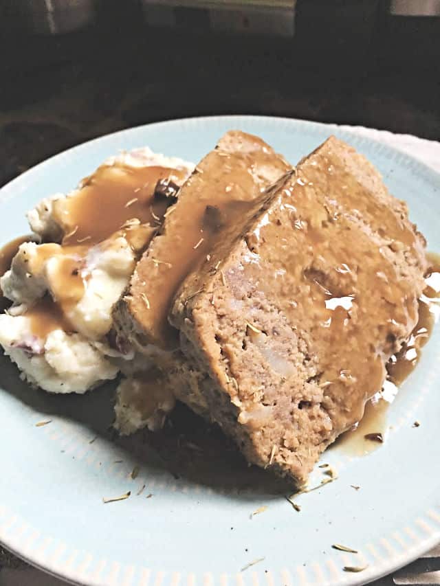 Close up of southern meatloaf, gravy and mashed potatoes