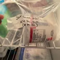 sour cream container in a freezer bag in the freezer