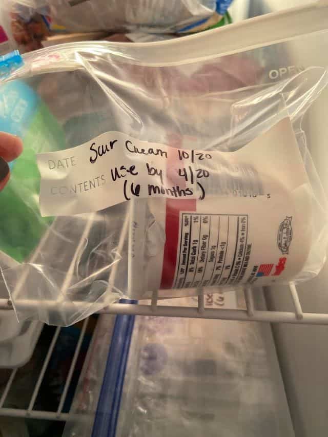 sour cream container in a freezer bag in the freezer