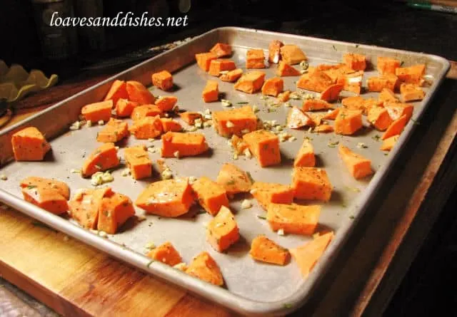 baking sheet with sweet potato scattered