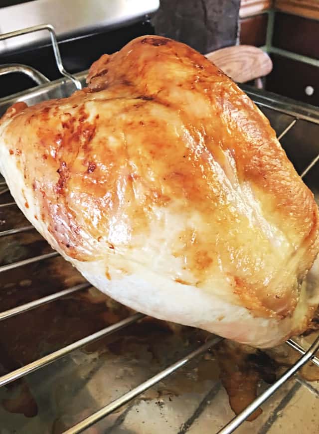 full turkey breast in a roasting pan