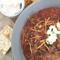 close up of the cheese on top of soup