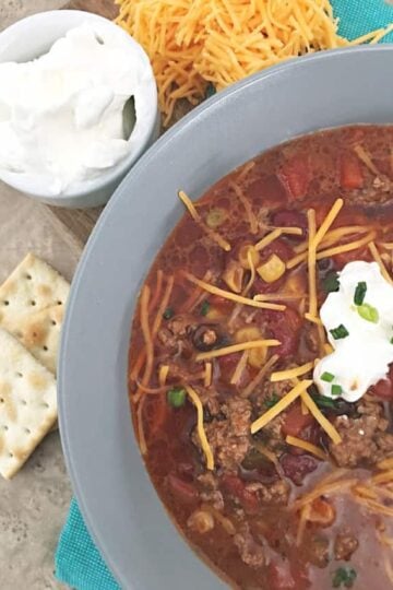 close up of the cheese on top of soup