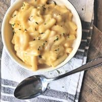 overhead shot of bowl of mac and cheese with spoon