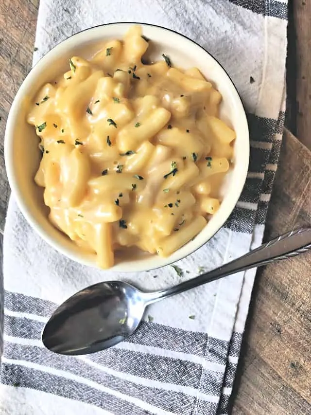 overhead shot of bowl of mac and cheese with spoon