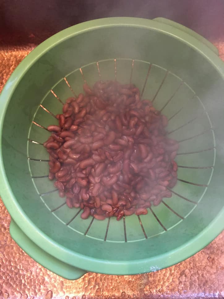 colander of red beans with steam rising