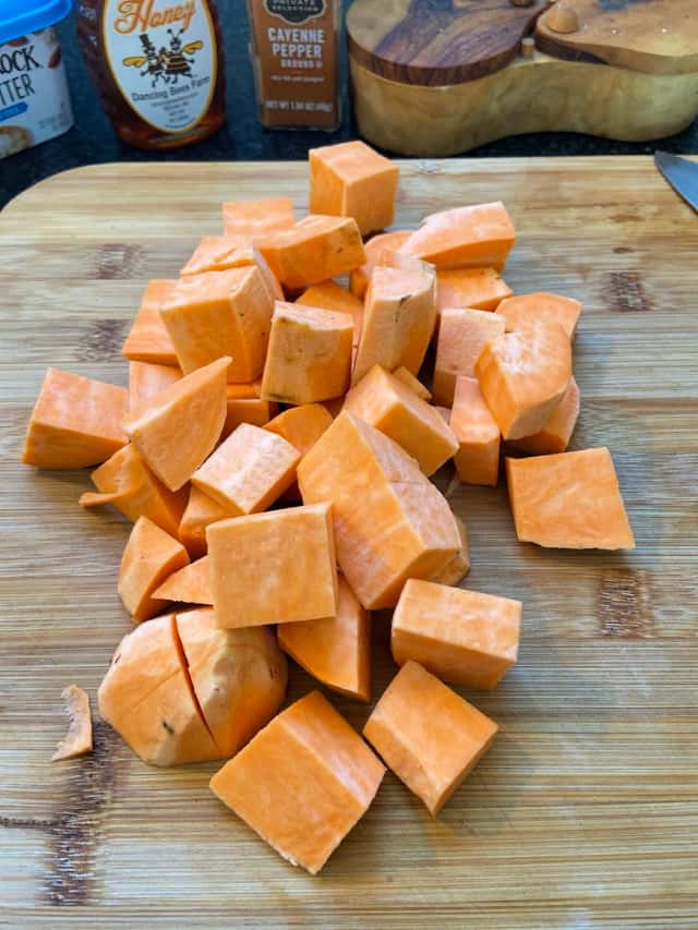Cubed sweet potato on a cutting board