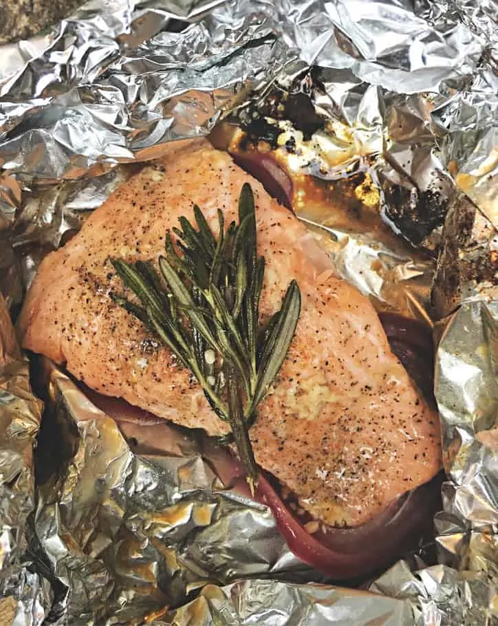 half pound piece of easy grilled salmon in foil with rosemary