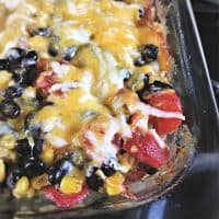 tomato pieces with cheese melted over the top for the Easy Taco Bake Casserole