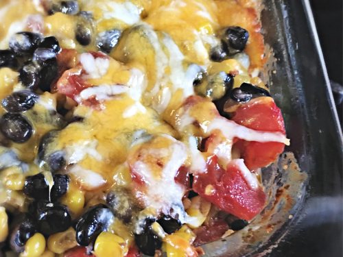 Easy Taco Bake Casserole tomato pieces with cheese melted over the top for the Easy Taco Bake Casserole