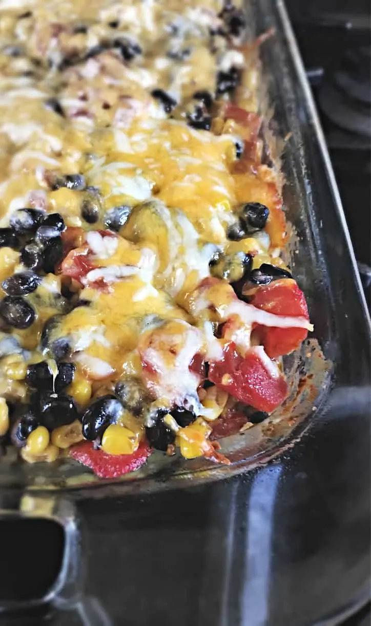 tomato pieces with cheese melted over the top for the Easy Taco Bake Casserole