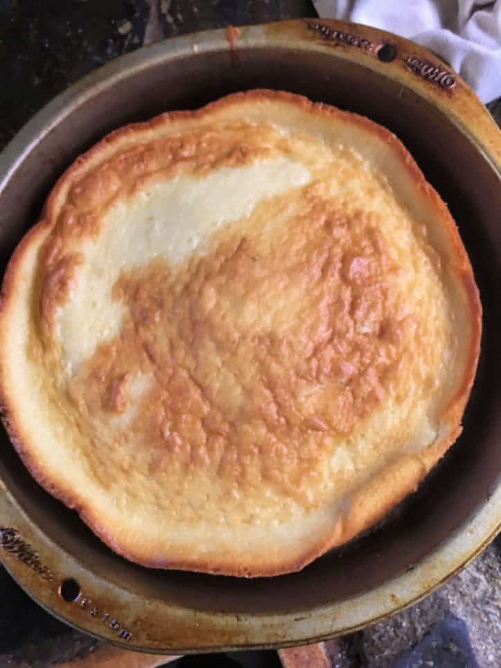 flattened cake in a cake pan with napkin