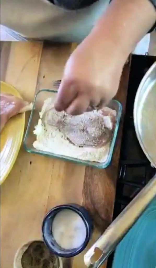 chicken breast floured in square dish