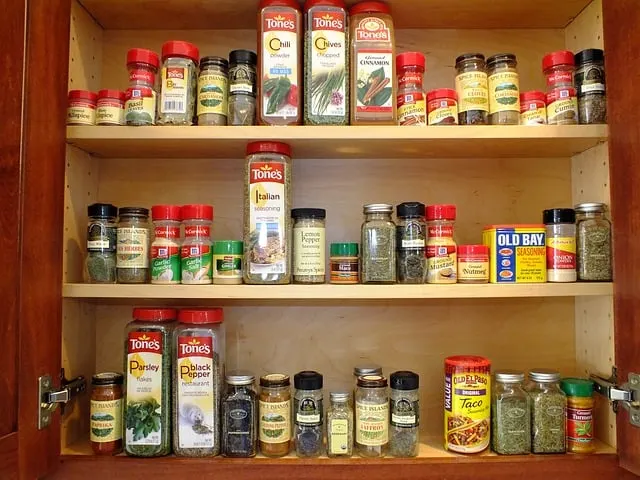 Wooden shelf with spices on it