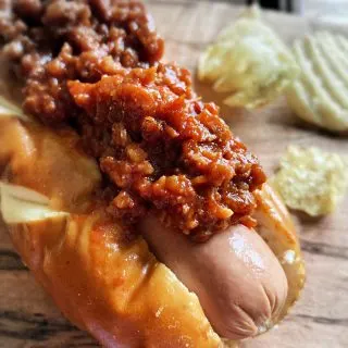 hot dog in bun with hot dog chili on top