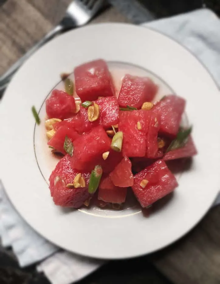 overhead shot of watermelon salad on a plate