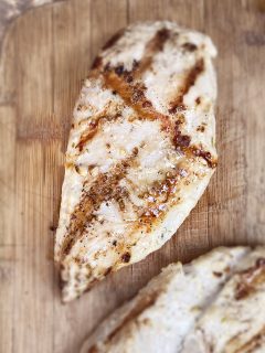 grilled chicken breast on board