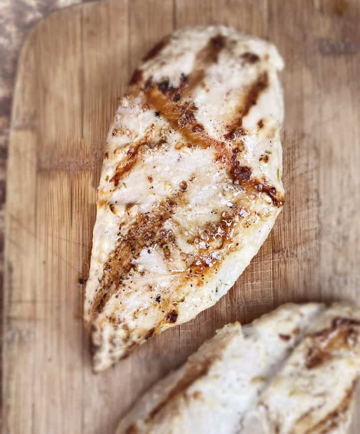 grilled chicken breast on board