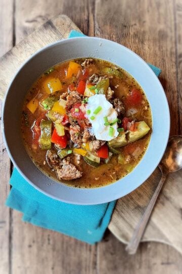 bowl of soup on table with spoon