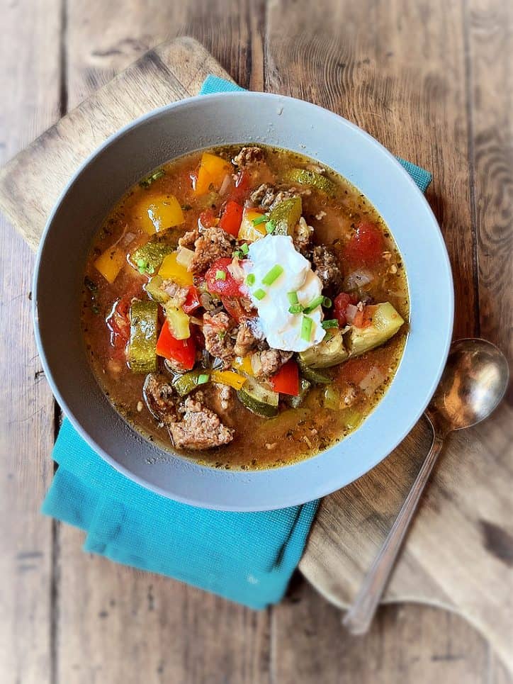 bowl of soup on table with spoon