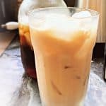 glass of vanilla iced coffee on table