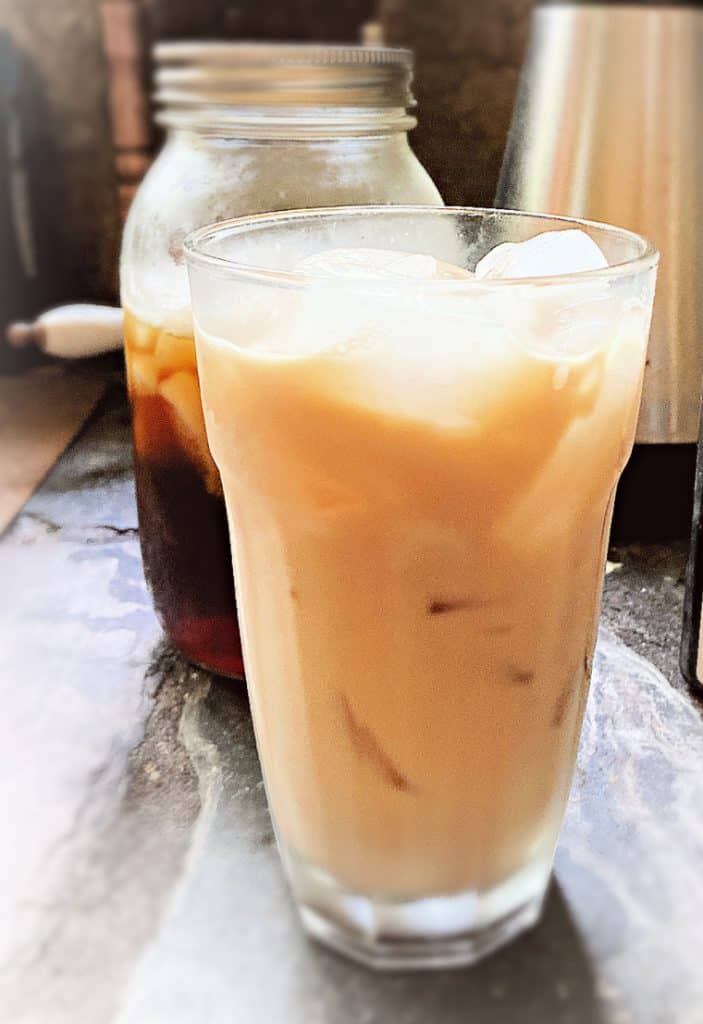 glass of vanilla iced coffee on table